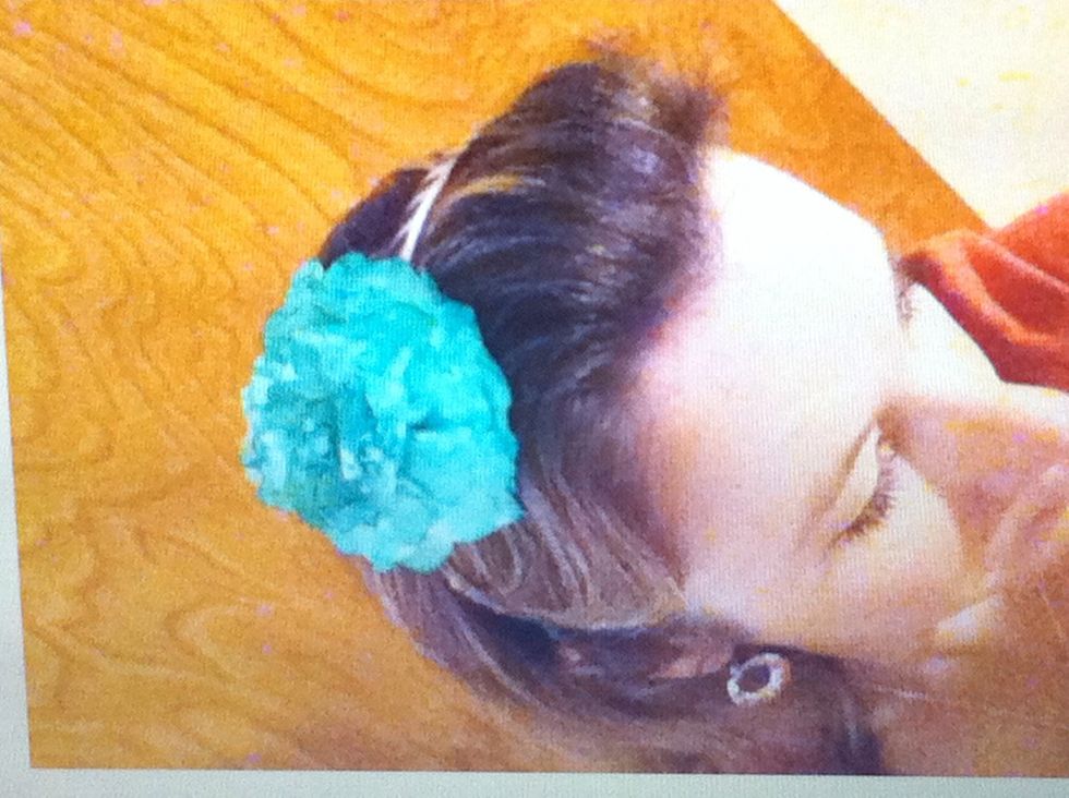 Or, cut 2 holes in the bottom 2 layers of the flower and slide a headband thru the holes.