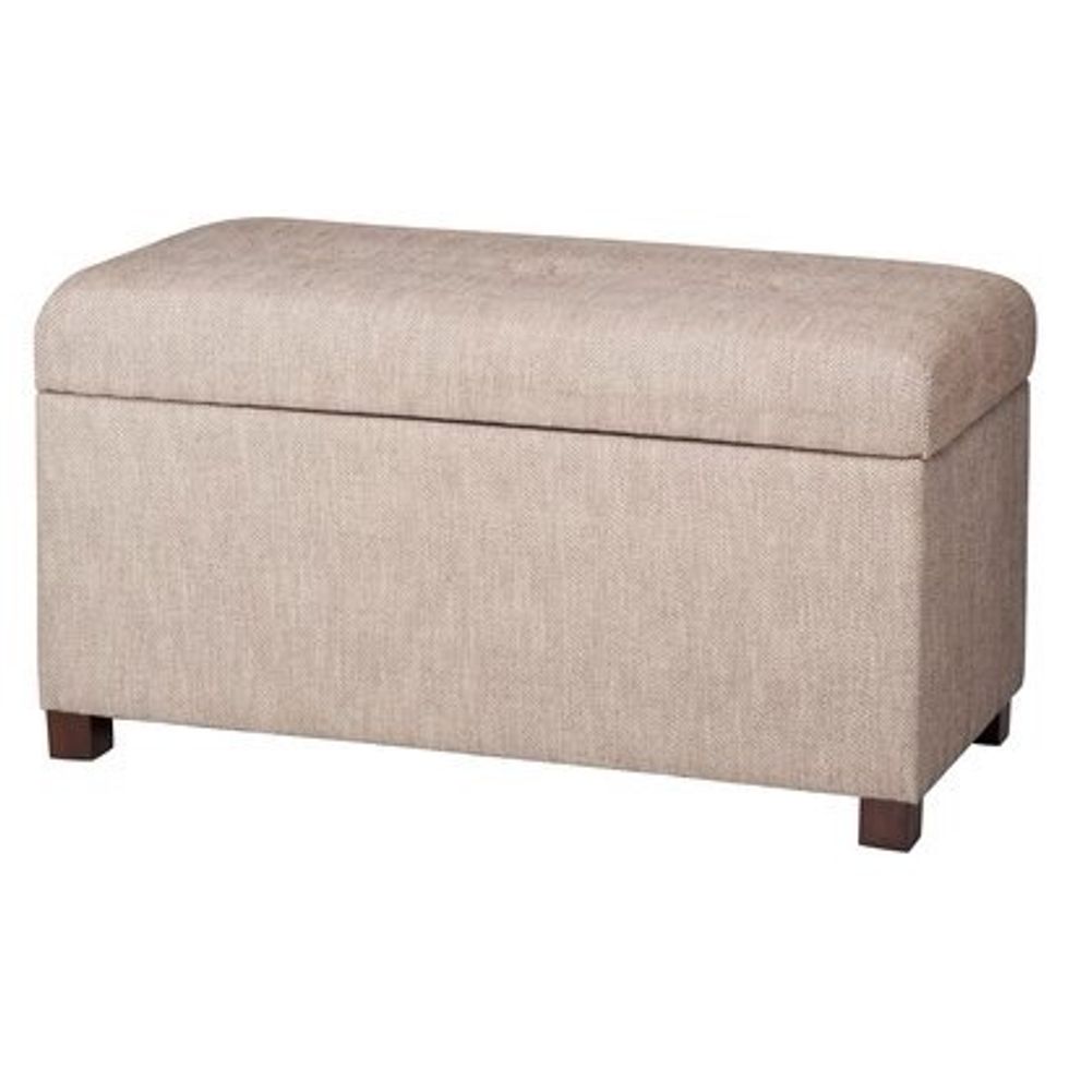 Or, place a storage ottoman at the foot of your bed.