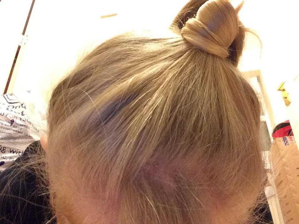 Or take a piece of hair from the ponytail, wrap it around the bobble, and Bobbie pin it at the back.