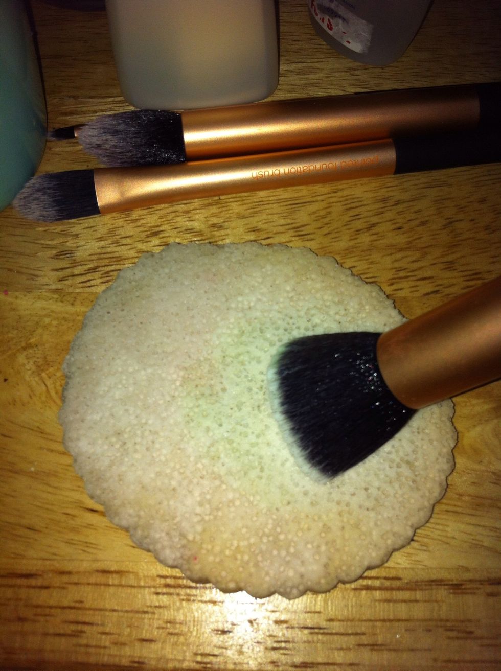 Or you can swirl the brush on the sponge after dipping it in the solution. On the plate, you will notice the makeup residue as it lathers up after you swirl the brush a couple of times.