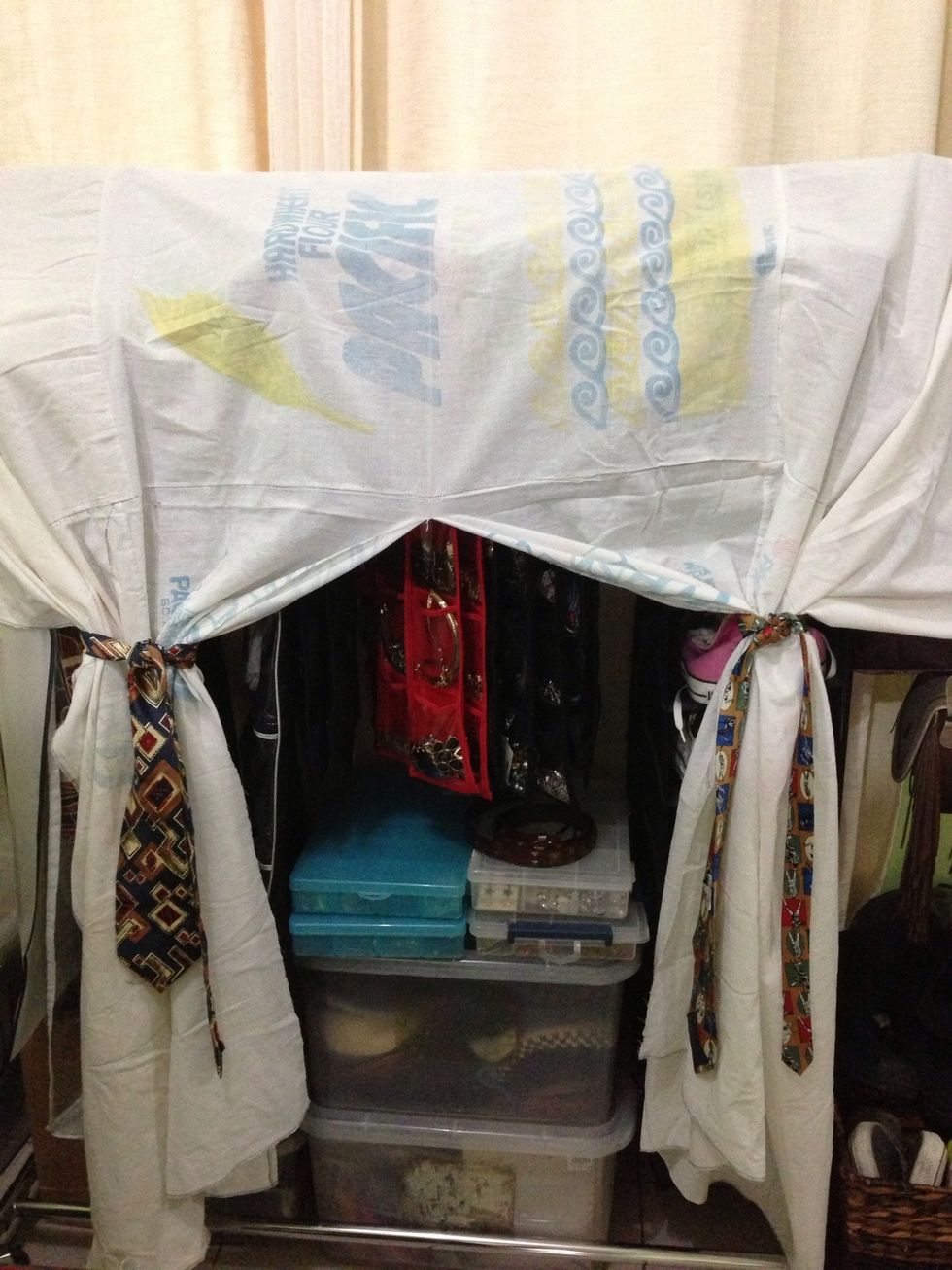 Or you can tie each panel with printed fabric/hair tie/ribbon or in this case,i used my dad's old ties. Now you've created a closet where you can see your things or maybe hide it. :)