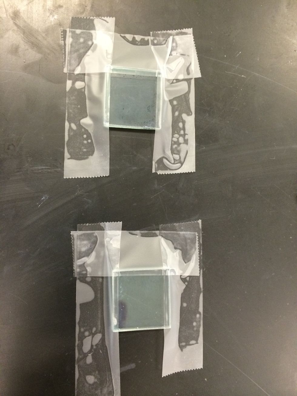 Orient the glass plate with the conductive side up. Place adhesive tape on three sides of the glass plate to mask a one mm strip on the edges.