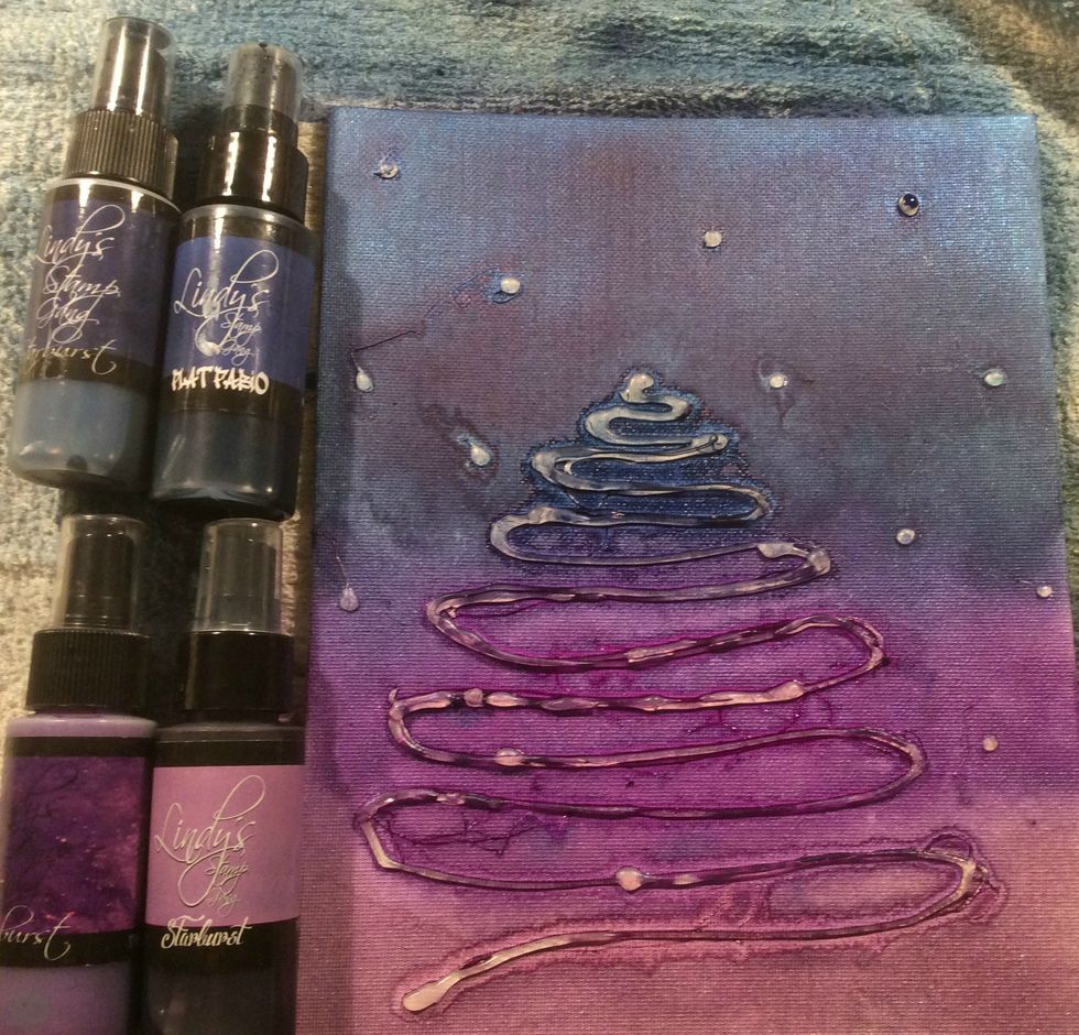 Originally I created a tree using my glue gun, but like alot of my projects, I changed my mind... so please ignore the tree..lol Spray your Lindys starting with the darkest.