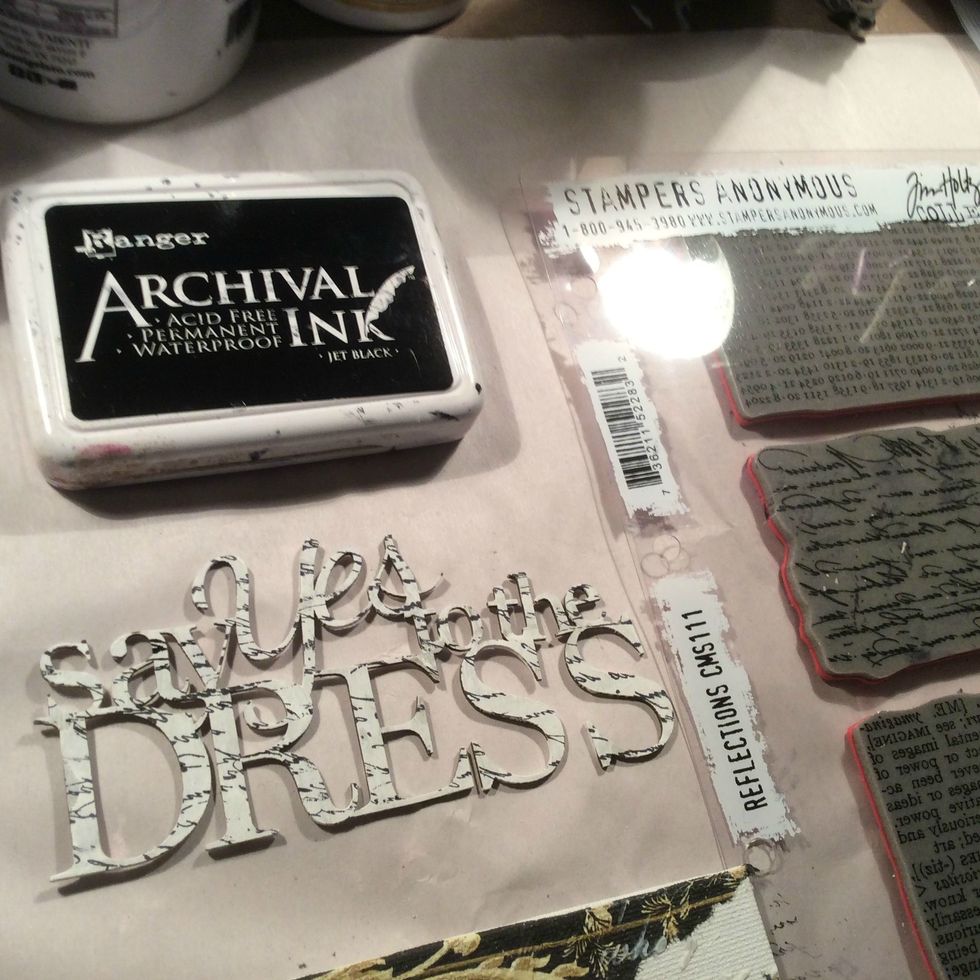 Originally I painted and stamped the title and didn't like it so then I covered it with white paint , let it dry a bit & then took a heat gun to it and caused bubbles and blisters to the paint.