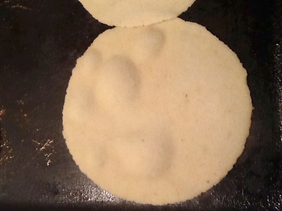 Ounce you place the tortilla dough on the hot griddle the tortilla will start to rise like this