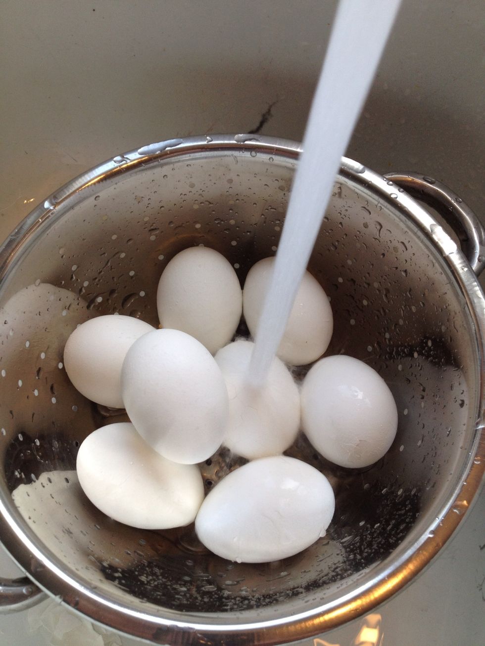Our eggs are now ready so drain and run cold water over them to stop the cooking process. You can also put them in a bowl of ice water to stop them from cooking further.