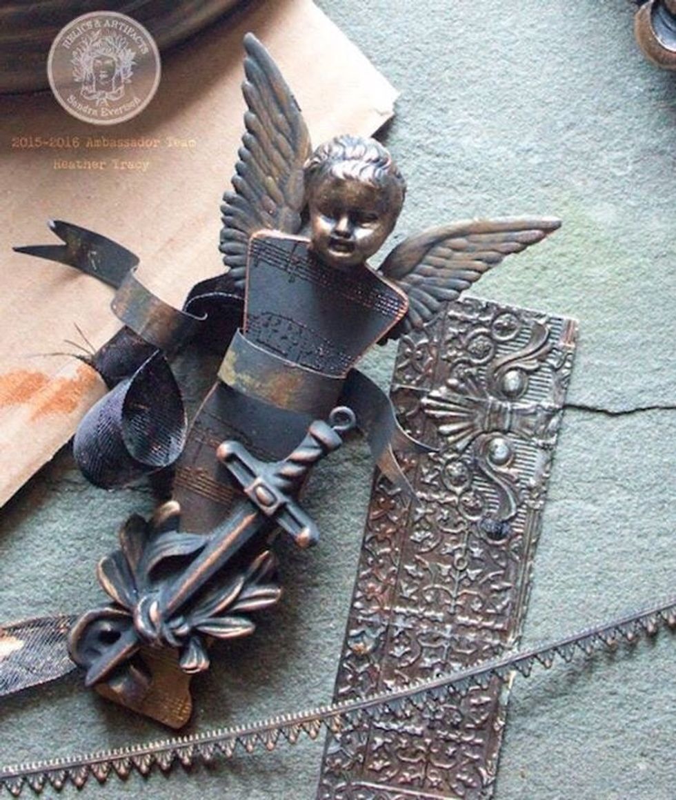 Our Pixie, has a wild fierceness within his heart. He carries a sacred emblem of protection, a sword . Wings support him, and will carry him wherever the plundered earth needs the spirit of life