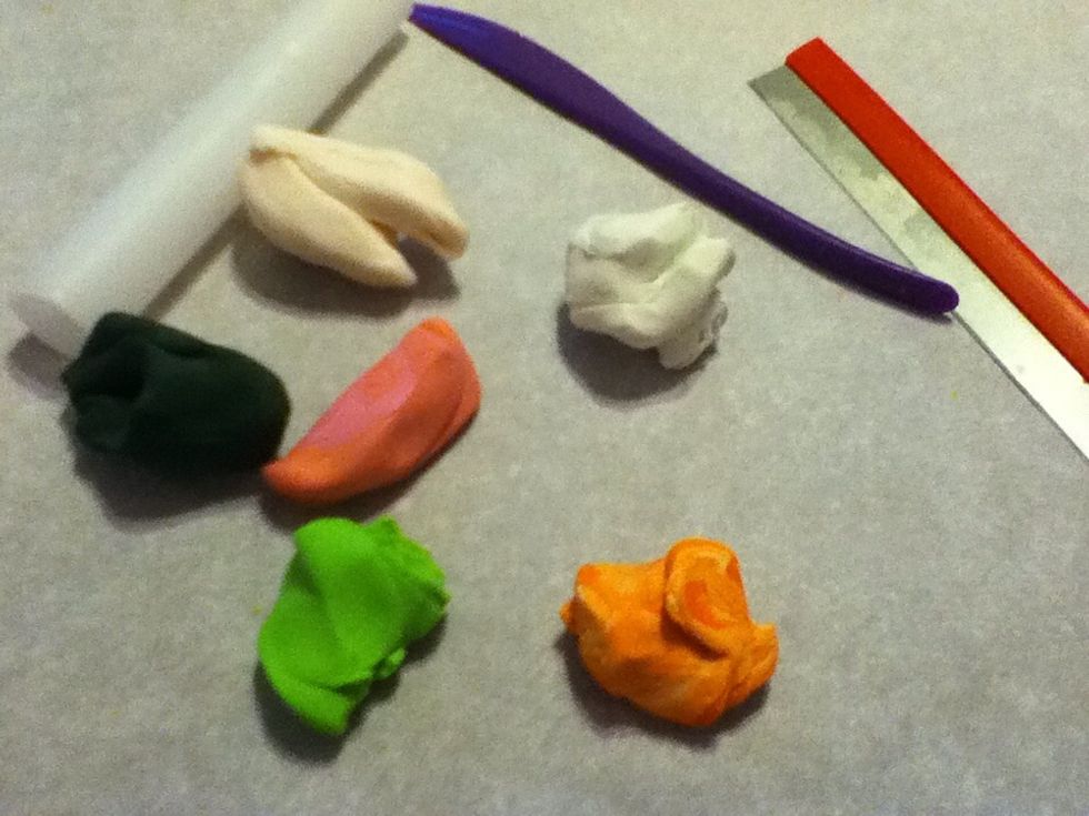 Our supplies. The clay colors are white, transparent, light green, orange, salmon, and a green/black blend.