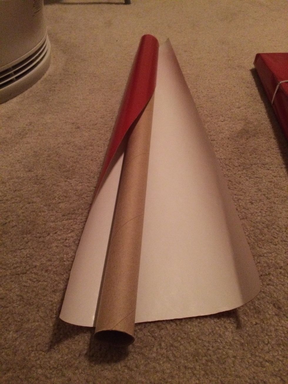 Our worst nightmare - 12am Christmas Eve and we get to the end of the wrapping paper but still have 1 present left! We could use all the scraps to cover the box in a patchwork way or we could weave it