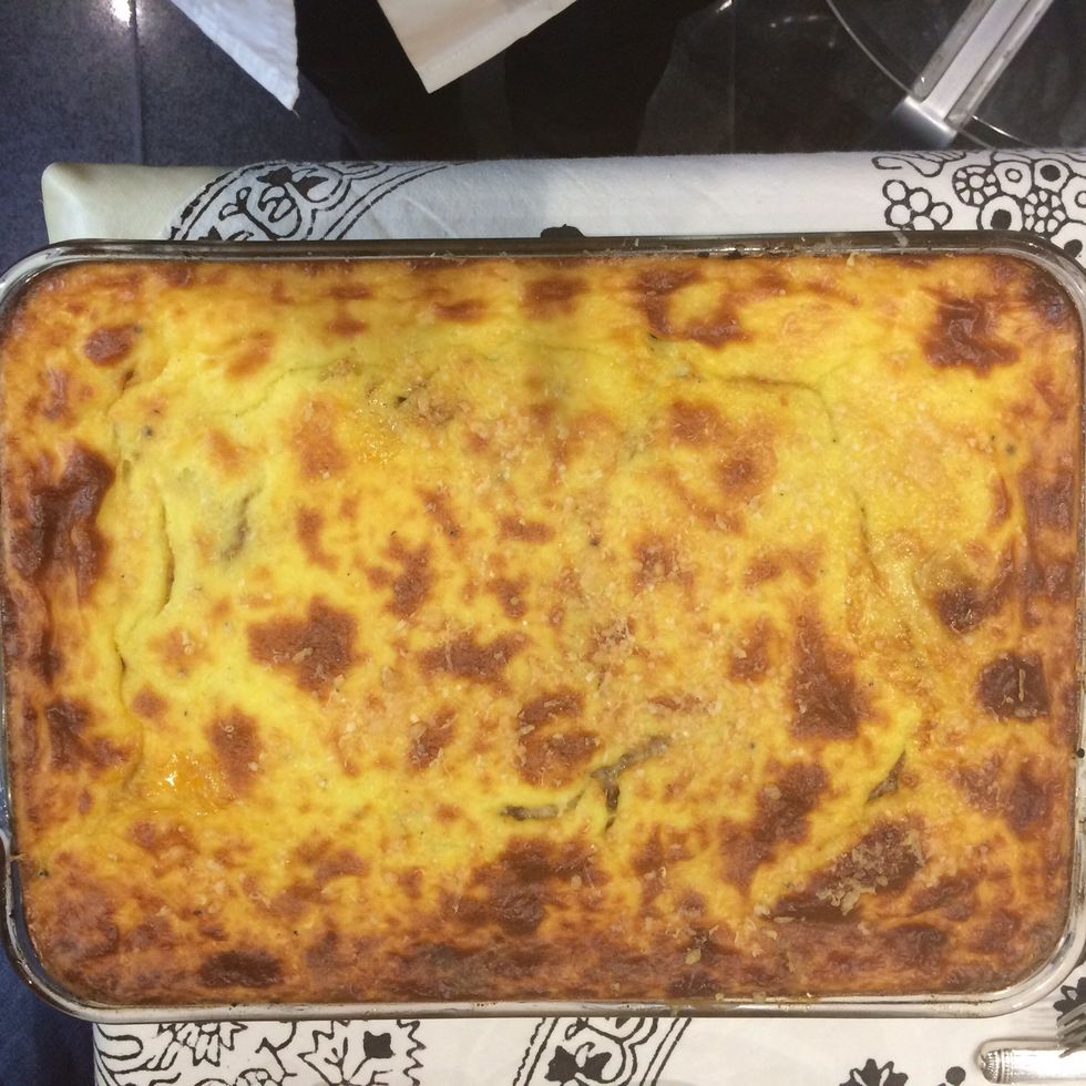 out of the oven..let cool down a bit. it will be easier to cut into parts.