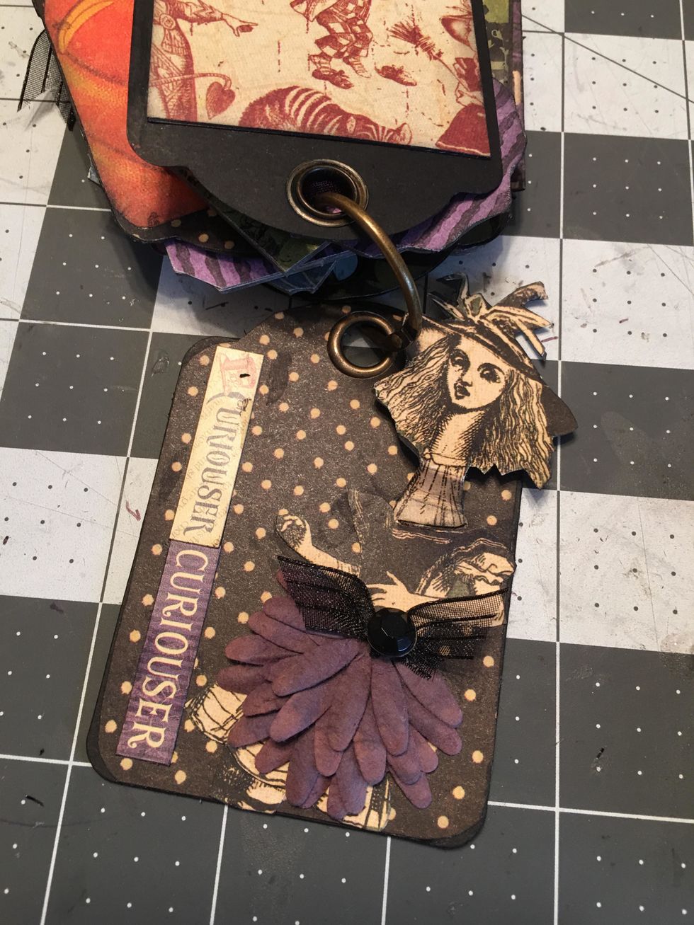 ...out of the top of her dress as shown here. Add a ribbon bow to the top of her skirt.