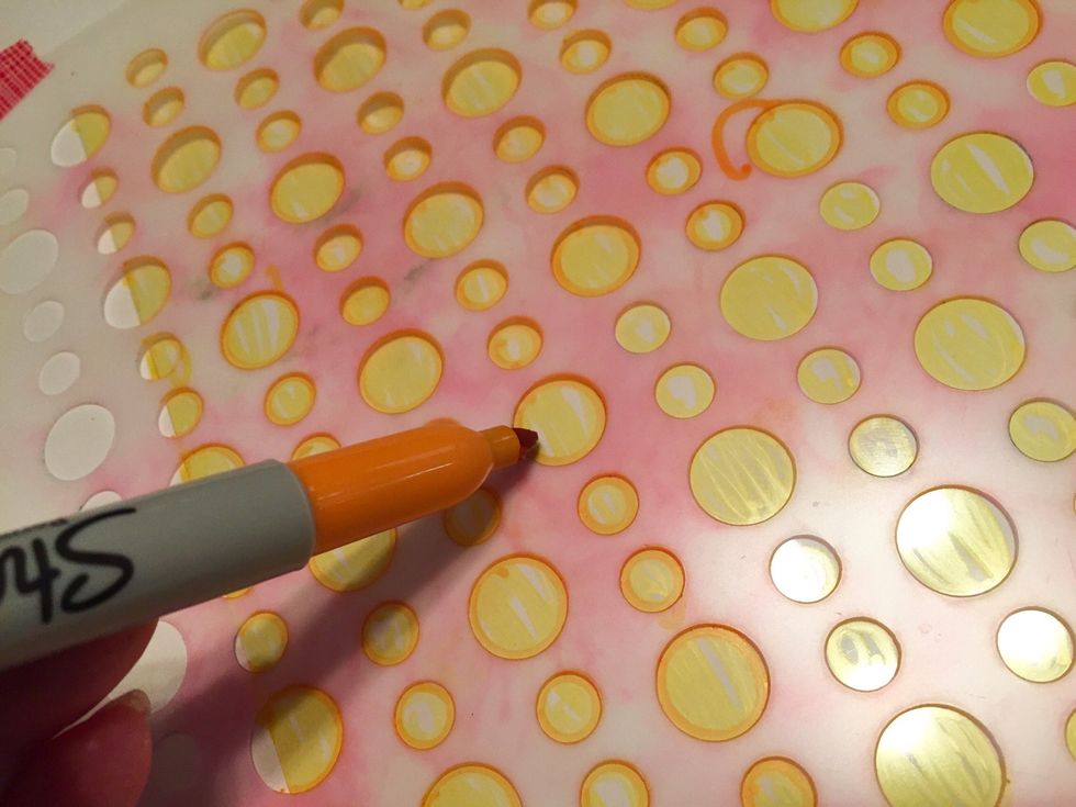 outline circles using Orange Sharpie.