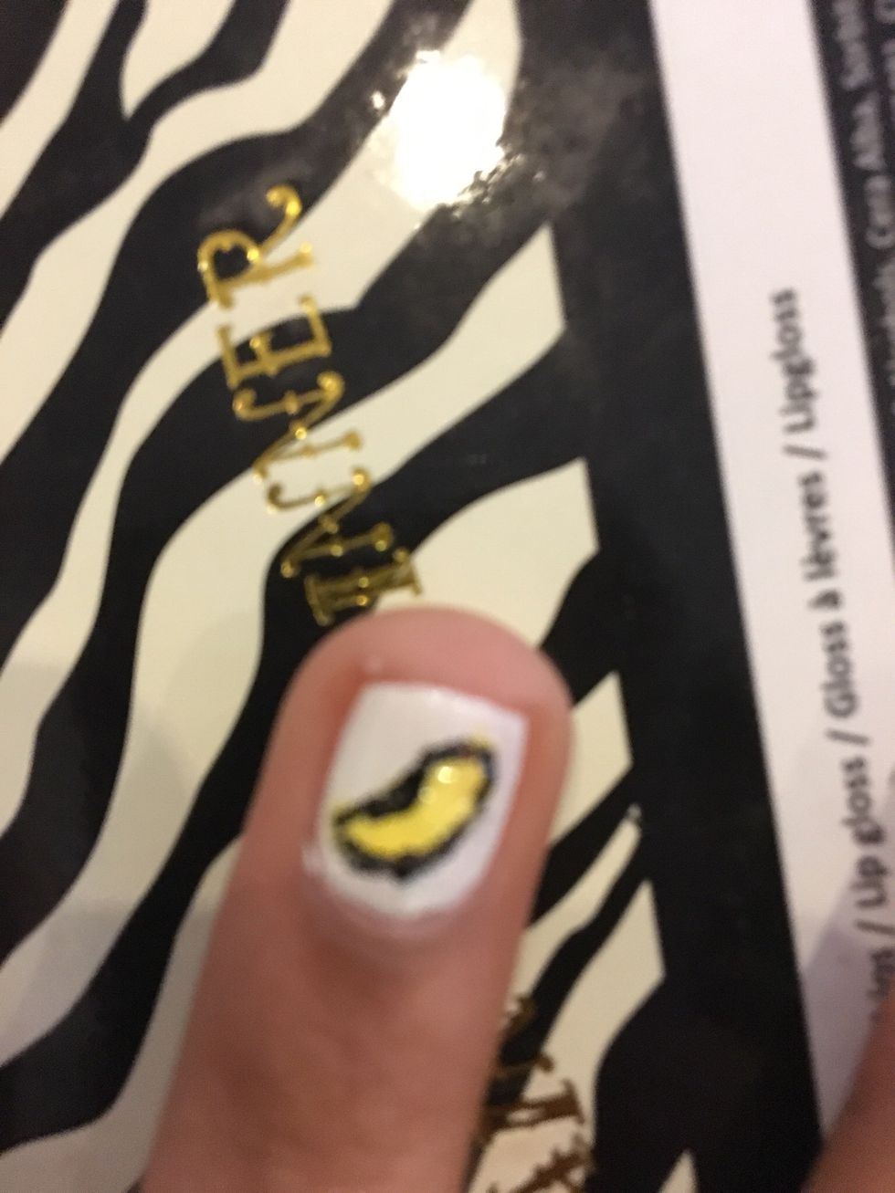Outline it in black. I made it a little thick and deep in one point for the shape.(sorry for blurry pic)