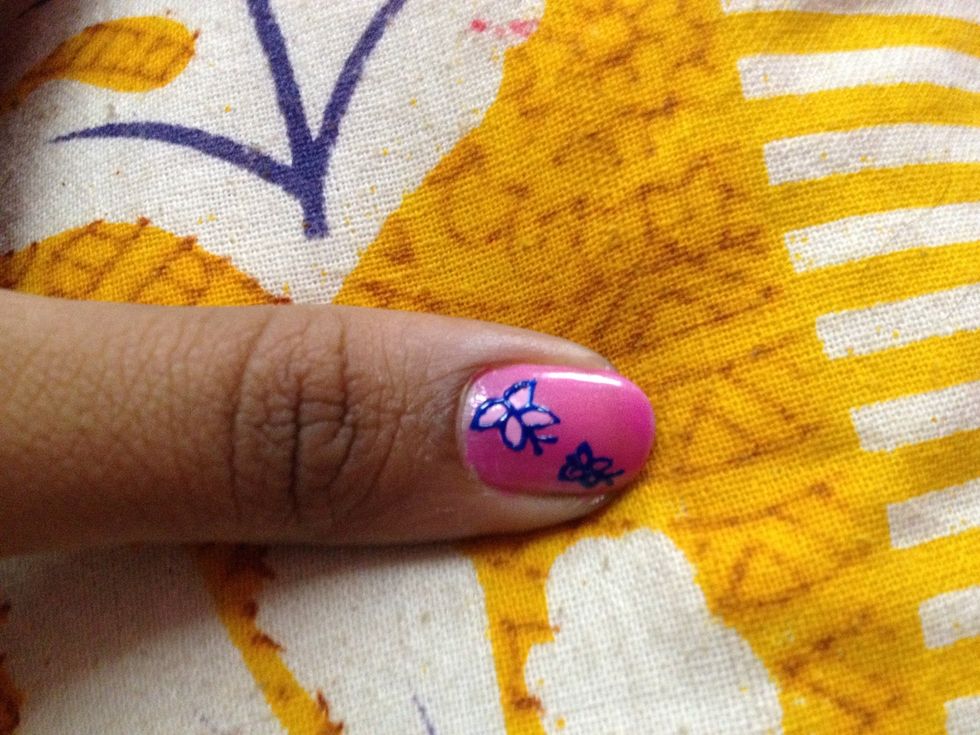 Outline the butterfly with a dark paint