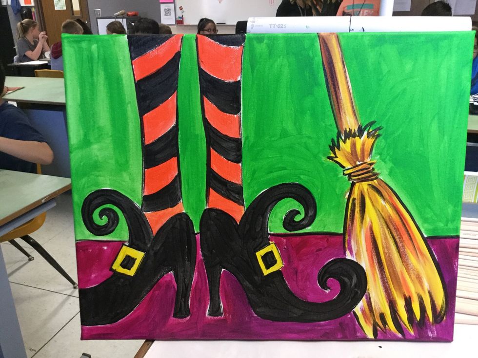 Outline the legs and broom with black. Add textured strokes to the broom.