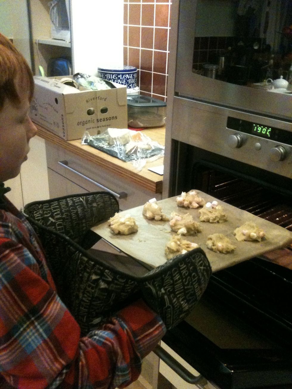 Oven gloves on. Cookies in the oven.