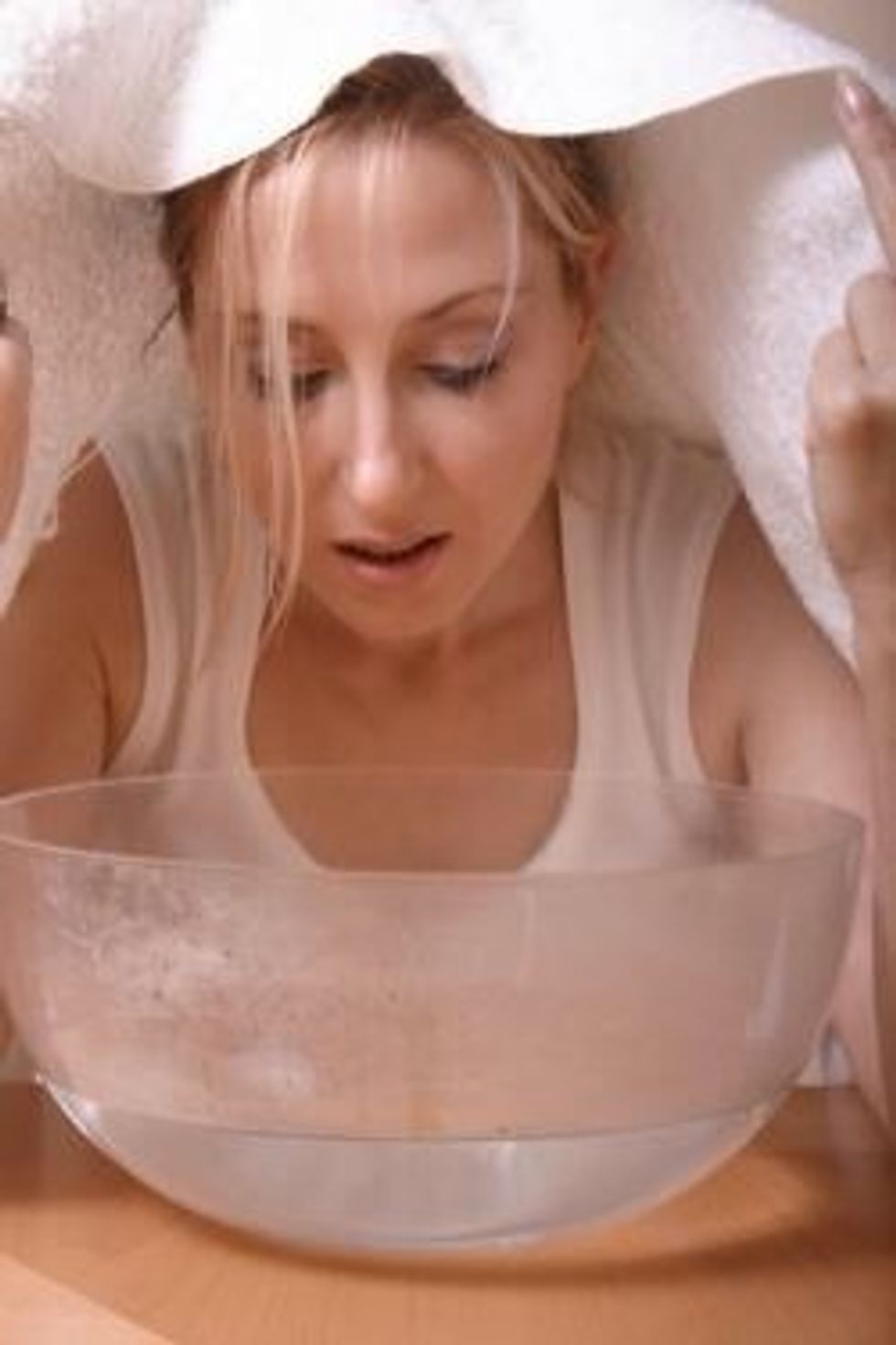 Over a bowl or pot of steaming hot water (right where the steam comes from), cover your face with a towel and stay there for 2 or 3 minutes. This softens the skin and makes cleansing easier.