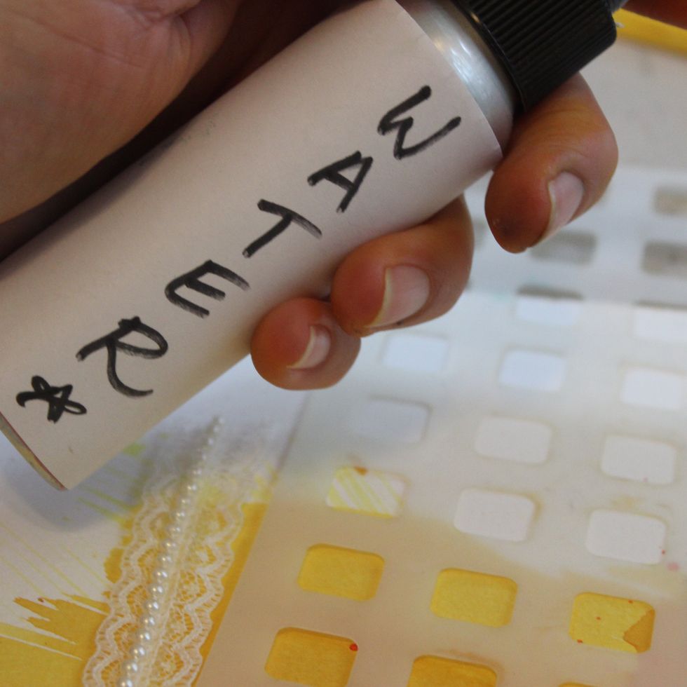 Over an area you already sprayed with Colorations, place a stencil and spray with water. Remove the stencil, wait a few seconds and them blot off water with a paper towel. This is called, Ghosting.