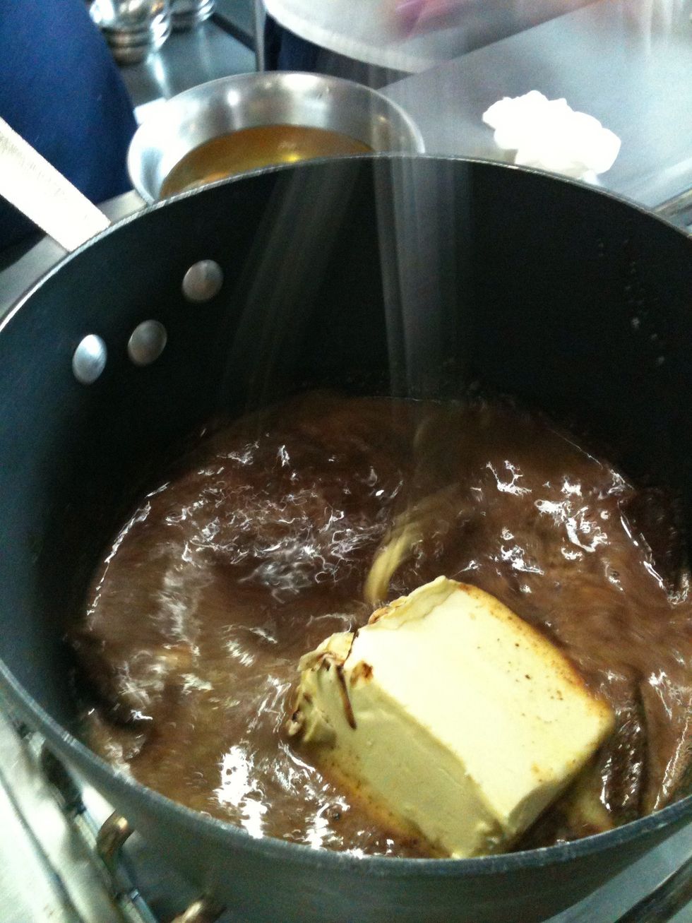 Over low heat add the margarine and beat slowly.