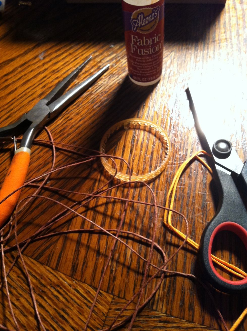 Over measure your main String. This will be the necklace part also so make it super long. If you're using a second color it it doesn't need to be as long as the first. About 2 1/2feet long maybe.