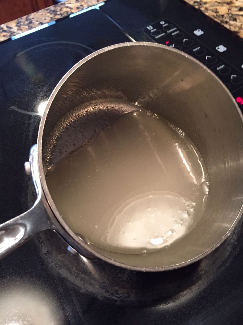 Over medium heat, bring 6 TB water, 3/4 cup sugar and 1 1/4 cup white corn syrup; to a boil