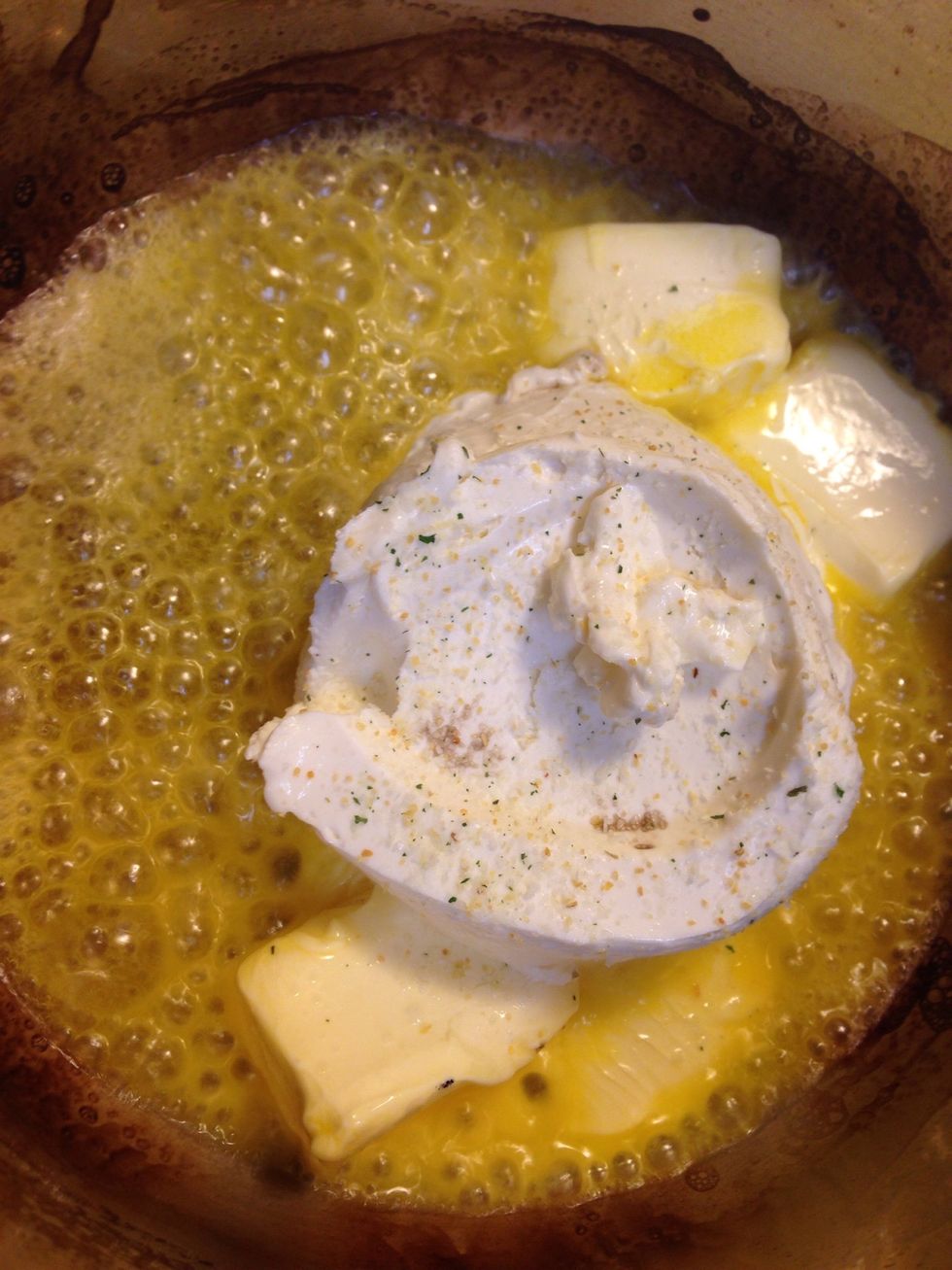 Over medium heat: Melt down your stuck of butter in a medium sauce pan. Add your cream cheese and garlic salt.!
