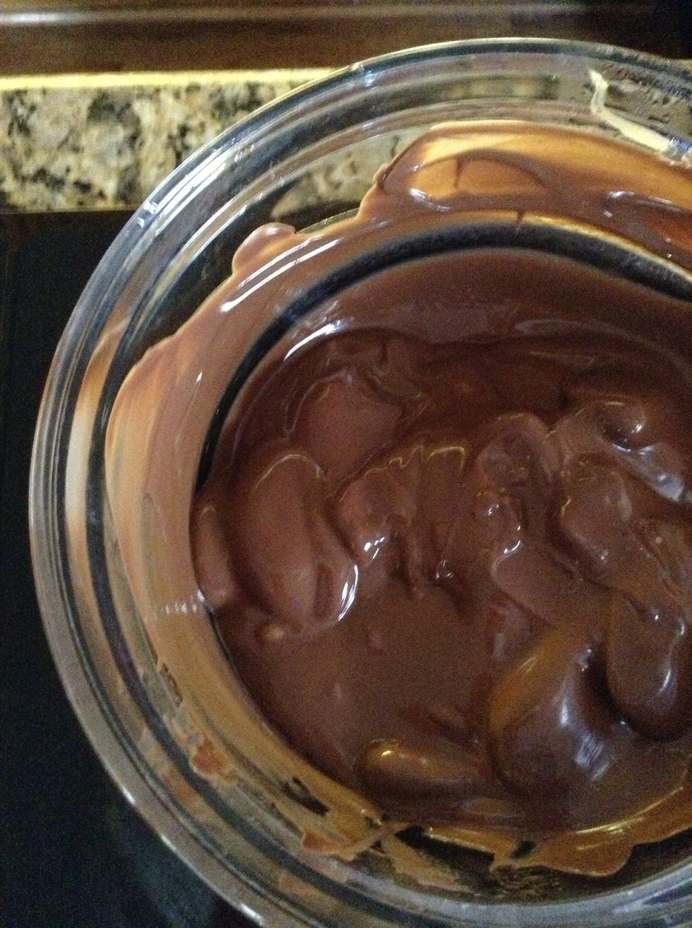 Over the double broiler, melt slowly as not to scorch the chocolate