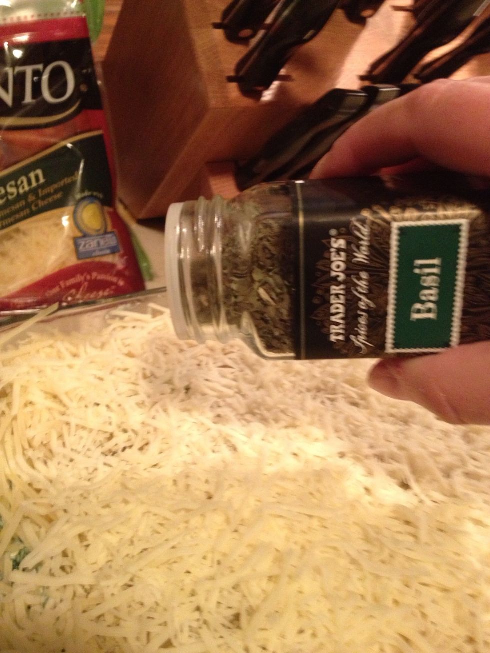 Over the top, sprinkle a little basil and oregano