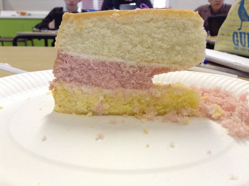 Over time the tide changes from low tide to high tide over and over again. This slowly erodes the pink layer in between