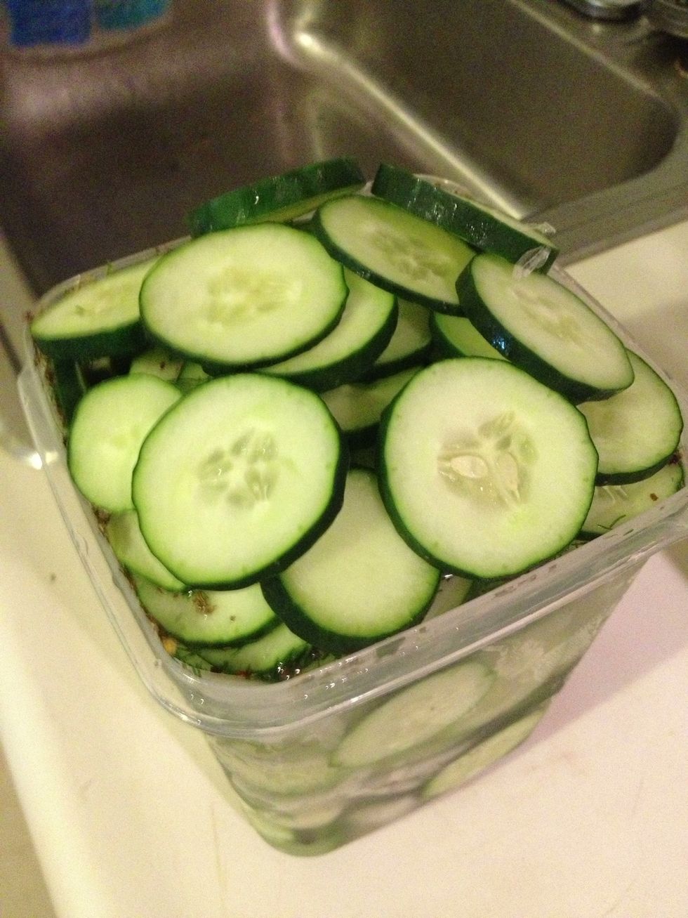 Overfill the container, press the veggies down, and then press the lid on, removing as much air from the batch as you can. I do this over the sink for when the pickling liquid spills out.