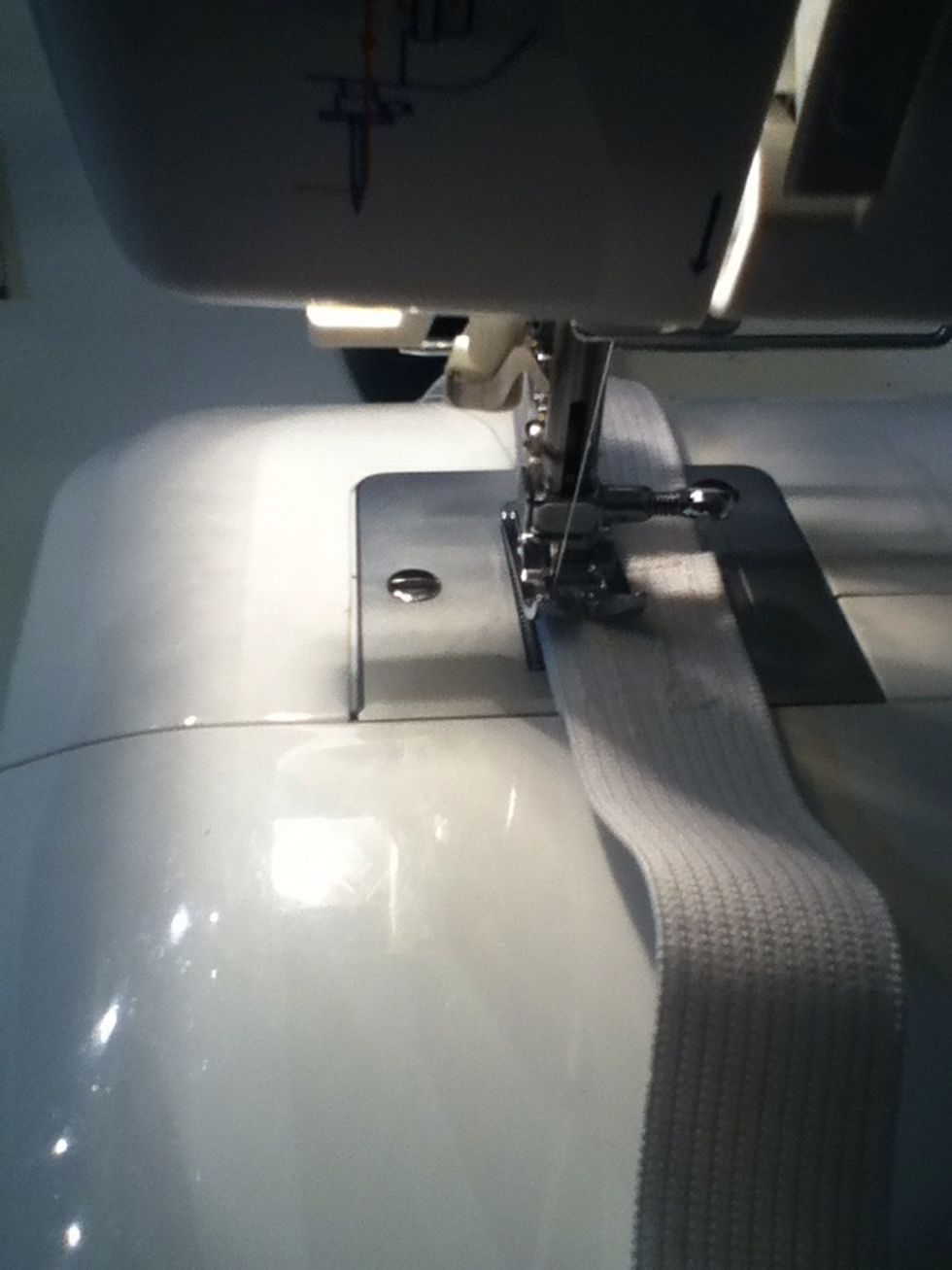 Overlap the ends of the elastic by an inch, and sew them together on a machine.