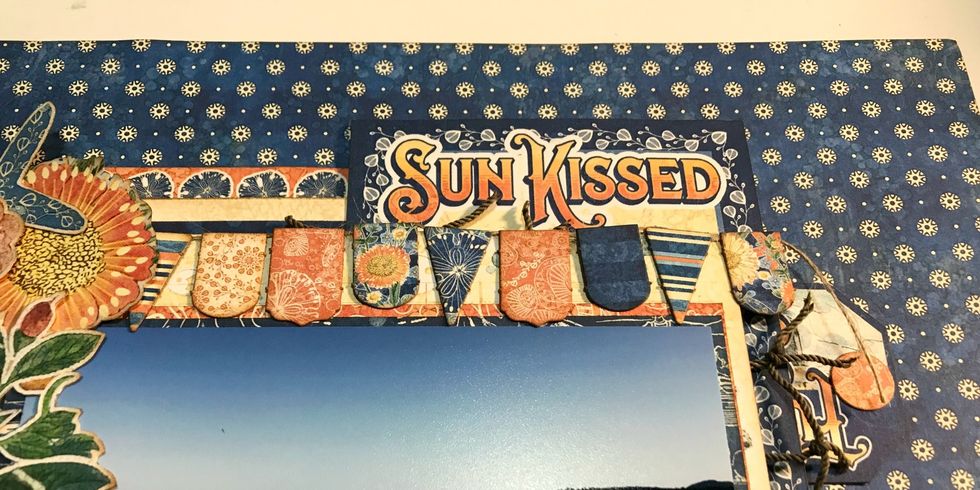 Overtop of the photo, adhere the banner.