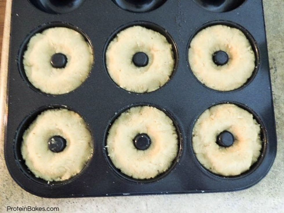 Pack donut tray with the batter.