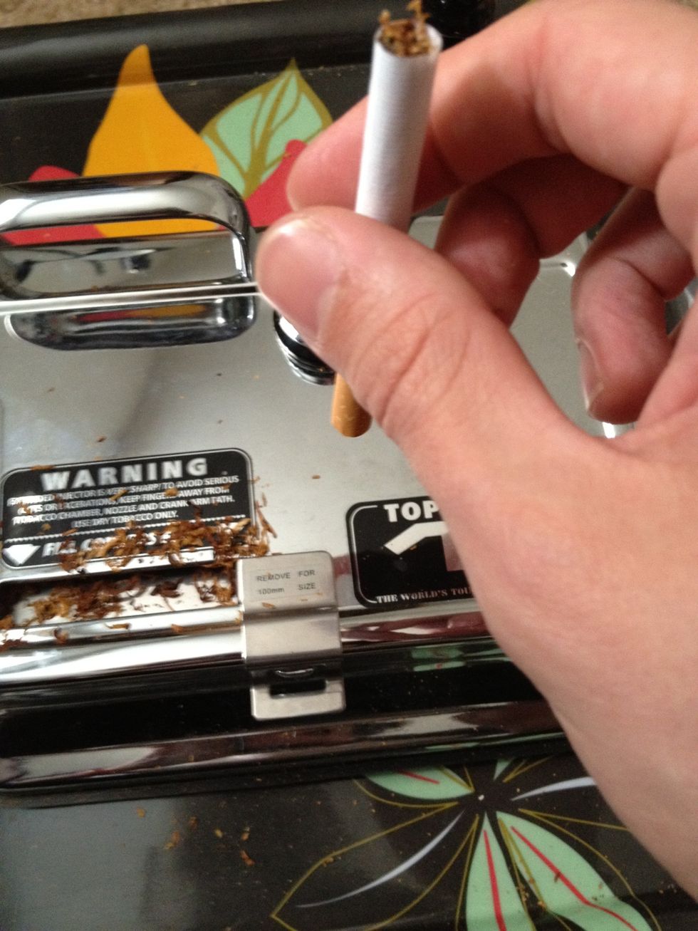 Pack down your smoke a couple times onto the roller to prevent tobacco from falling out.