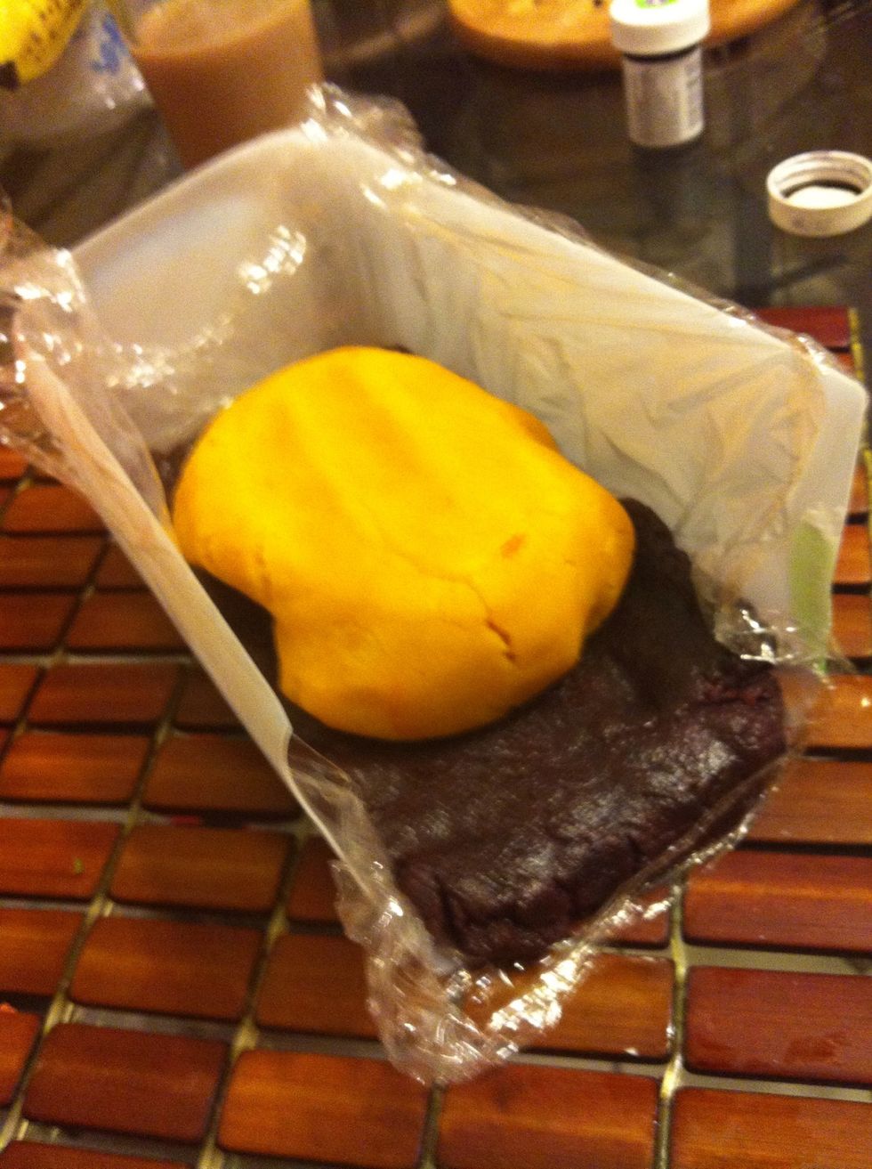 Pack each ball into a rectangular container lined with plastic wrap that you will slice your cookies out of. We only had a milk jug that we cut into this shape...be resourceful! :)