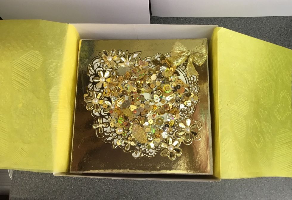 Packed in its box, gold sequins added!