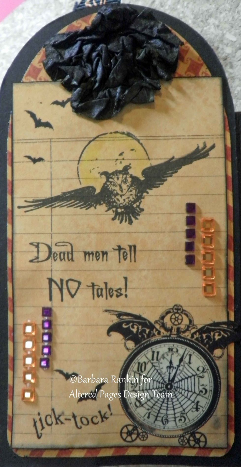 Page 11 right: G45 journal card, Sin City Stamps: Dead Men Tell No Tales, Owl with Moon, stamped in black, black handmade paper flower, gem stones.