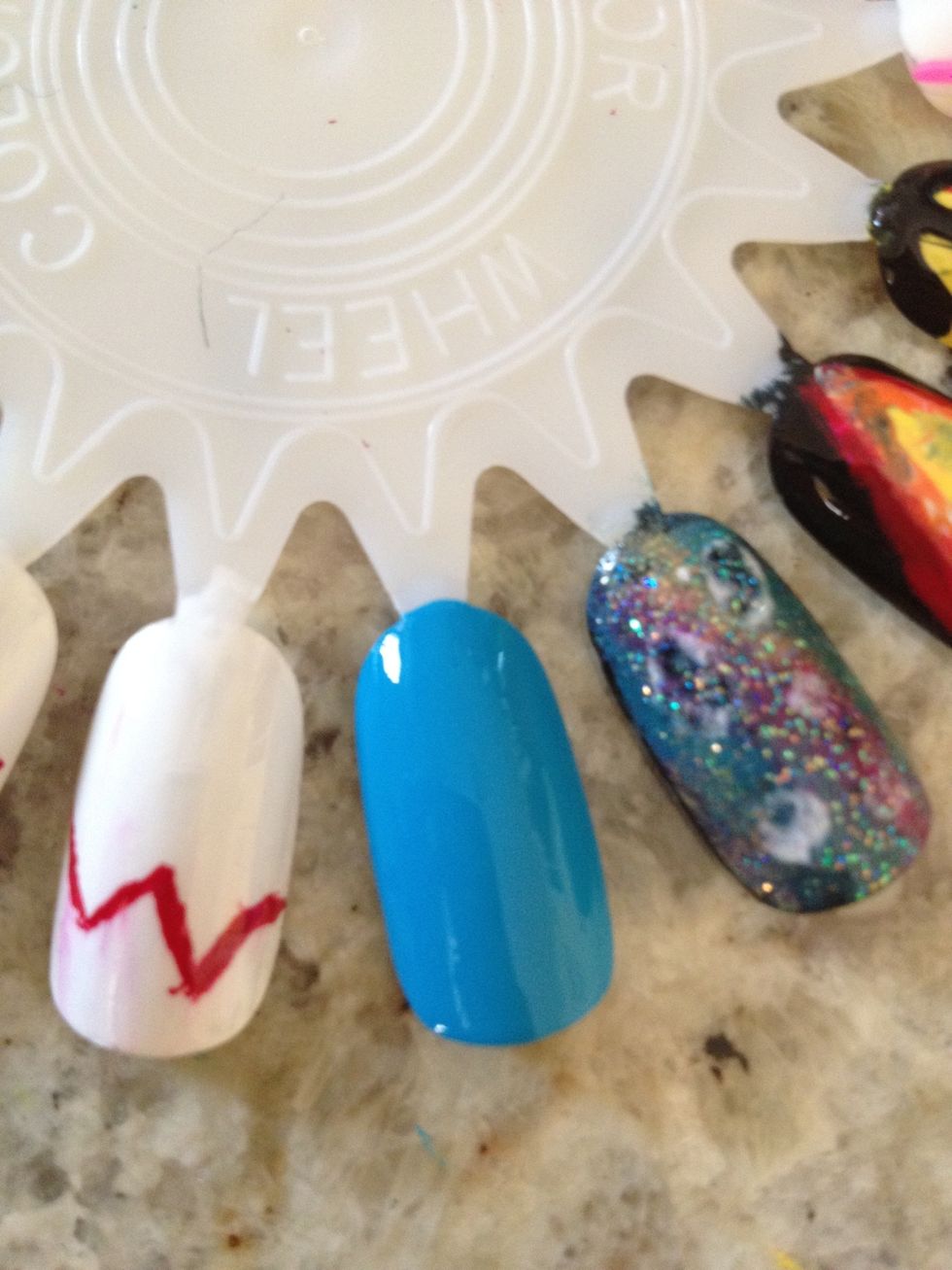 Paint 2 coats of sky blue nail polish on your whole nail