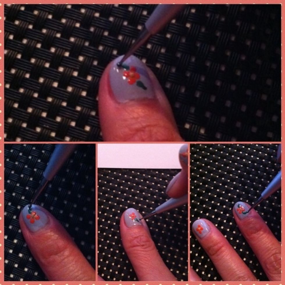 Paint 3 very short lines next to he coral dots. Repeat this for all your nails.