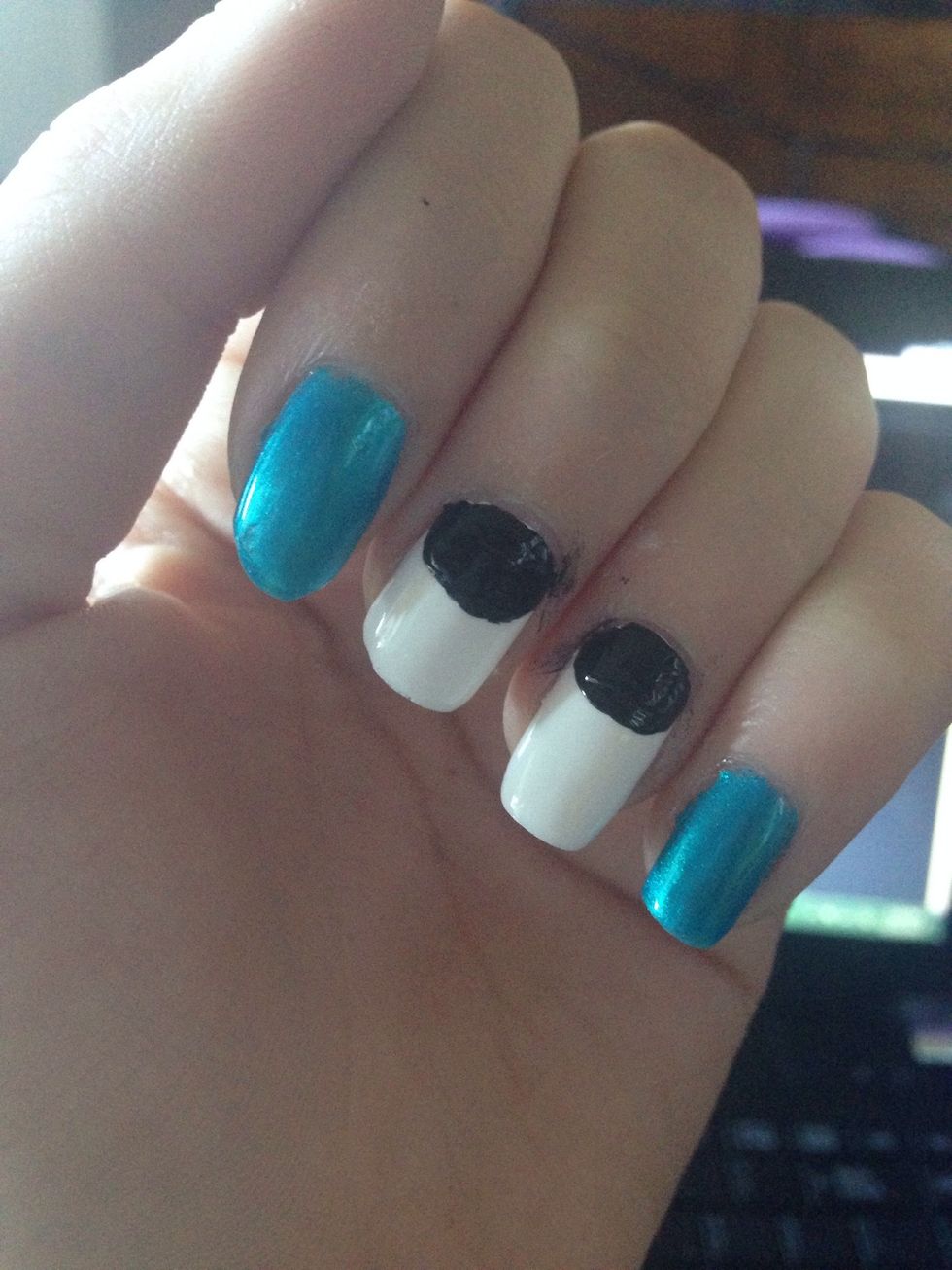 Paint a black half circle at the moons of your nails. This will probably get messy so either use tape or be prepared to clean later.