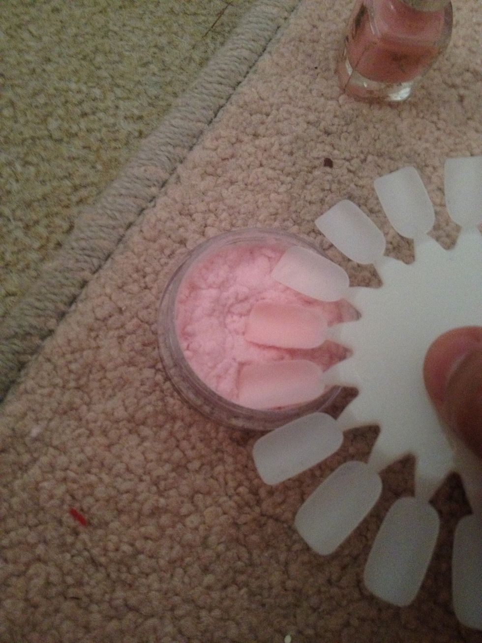Paint a fresh coat of nail polish on top. While its wet push the nail in to the fur to coat it well