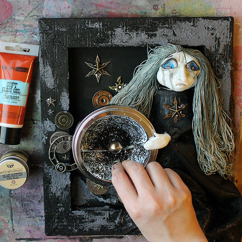 Paint a layer of Soft Gloss Gel inside the light and then sprinkle black Glass Glitter on it. Let the piece dry thoroughly.