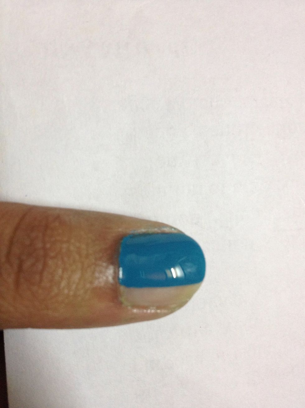 Paint a little more than half your nail with this colour.