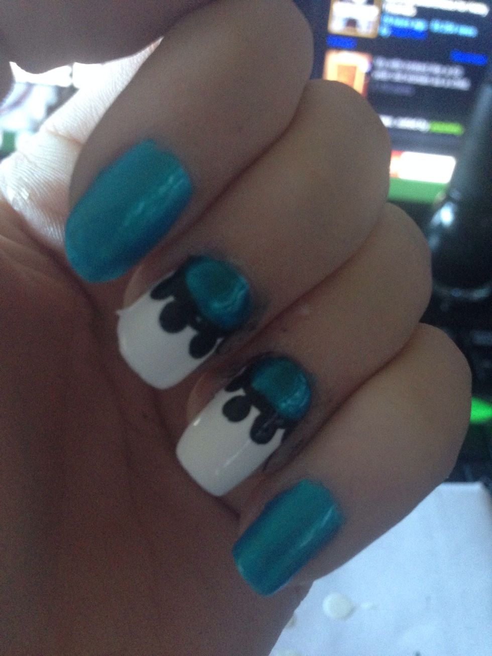 Paint a smaller circle inside the black one using your color. Leave a strip of black showing.