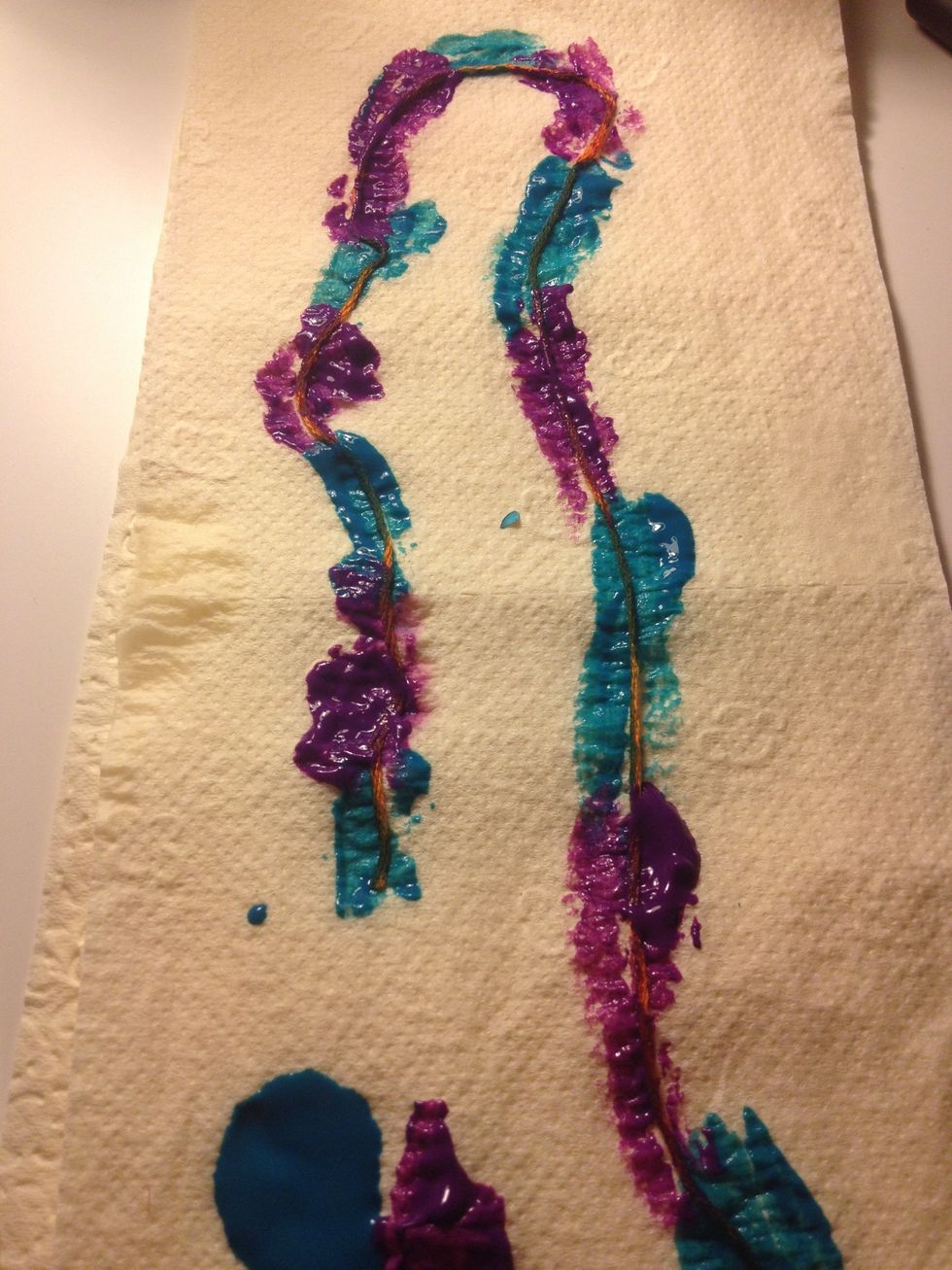 Paint a strip of string in any pattern you like (we alternated purple and blue)