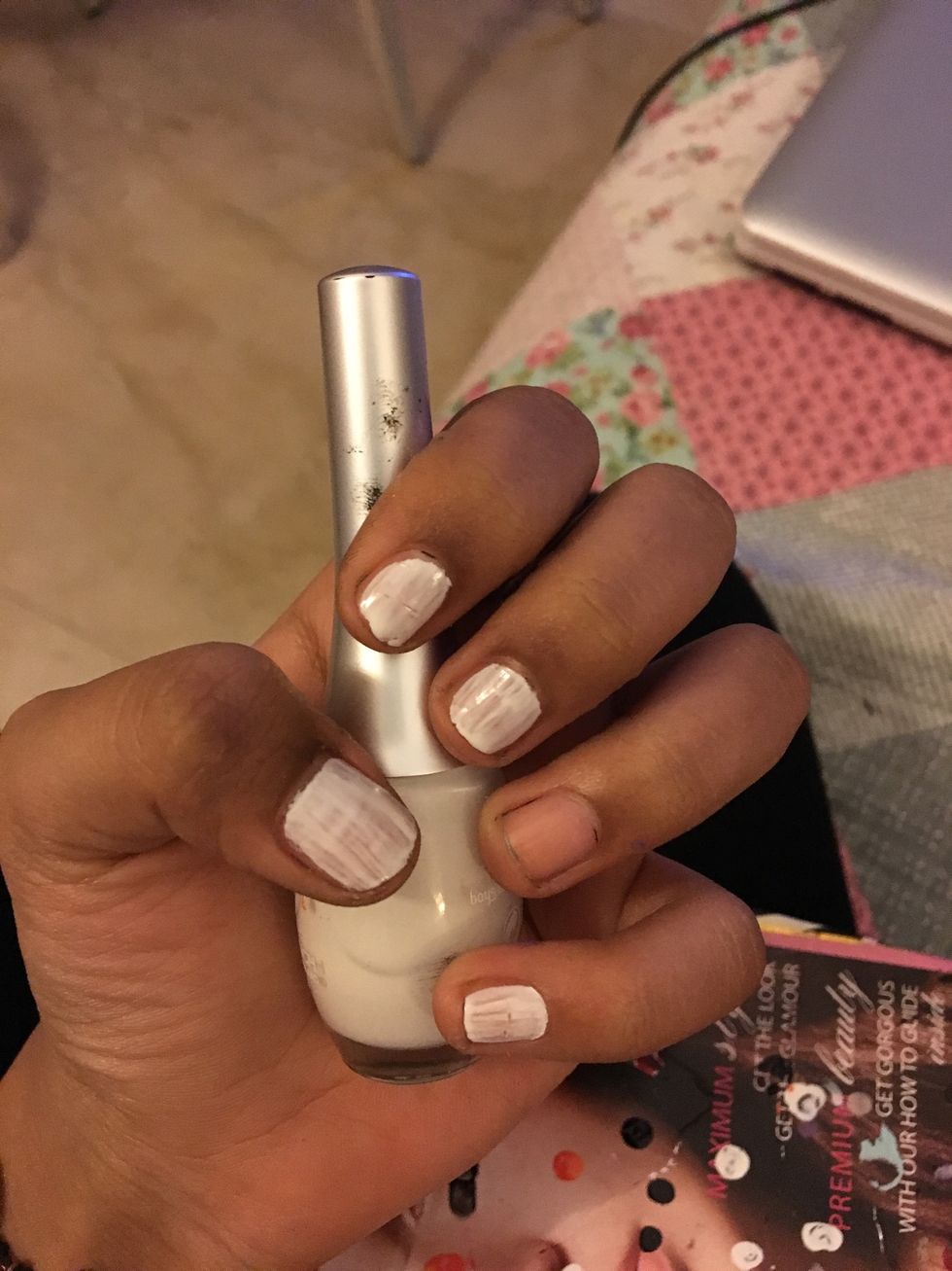 Paint all nails except ring finger white. This is the first coat