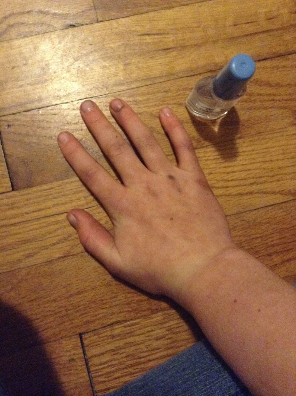 Paint all of your nails with one coat of clear polish.