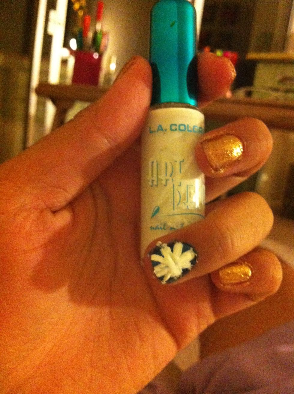 Paint an asterisk on the accent finger. Make sure it's thick so you can paint the red over it