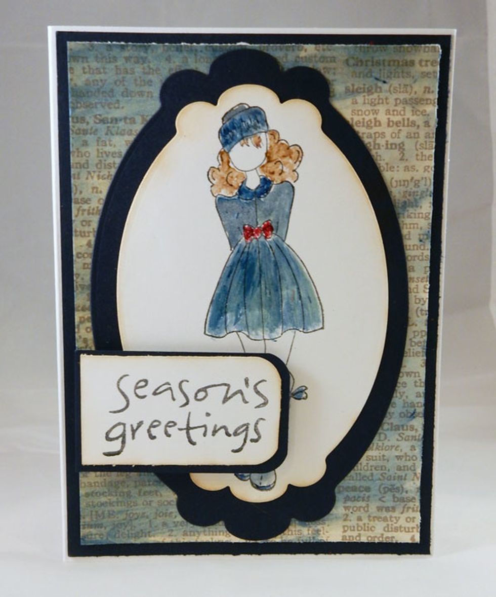 Paint background paper with Blue Topaz Gemstones. Stamp image and paint with Blue Topaz Gemstones. Paint Garnet Gemstones on the bow and Chocolate Sorbet on her hair. Die cut and add to card.