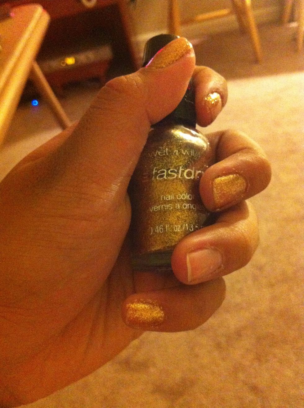 Paint both hands with gold. Leave one nail blank. That will be our accent nail (British flag). You can use whatever finger you choose. I used 2 coats.